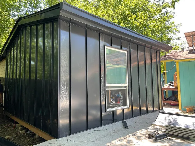 Black standing seam metal wall panels for Metal Roof Installation in North Fort Lewis