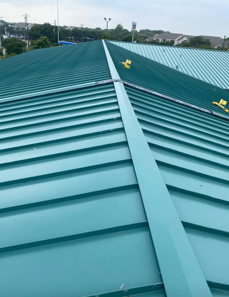 Green commercial metal roof ridge and valley for Metal Roof Repair in North Fort Lewis